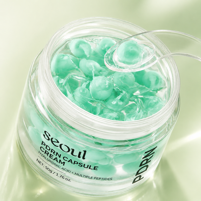 Jar of Seoul PDRN Capsule Cream with green gel-like substance on a light green background
